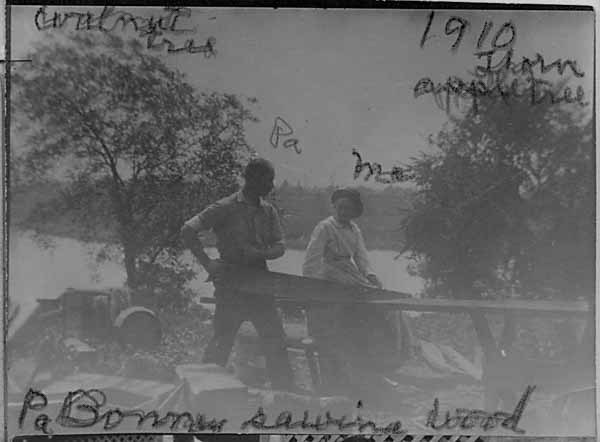 1910-Pa-and-Ma-Bonney-Pa-Sawing-Wood.-Also-Walnut-tree-and-Thorn-Apple-tree