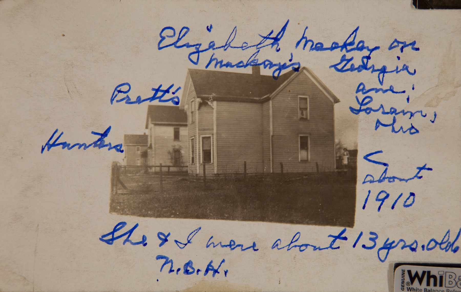 1910, Elizabeth Mackey [to the right of house], Georgia ave, Lorain Ohio, She & I [Nellie B Harnish] we about 13 yrs. old.[second house is the "Pratt's" and third is the Hunters"