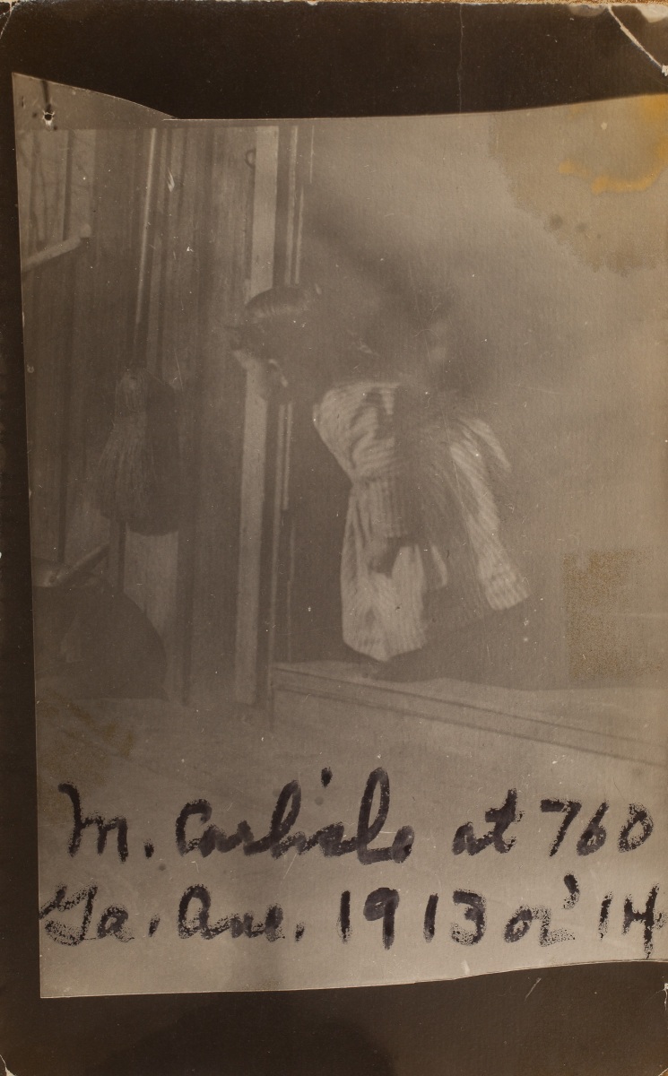 1913-14 "M[artha] Carlisle at 760 Ga. Ave. 1913 or '14" Peeking out of front door