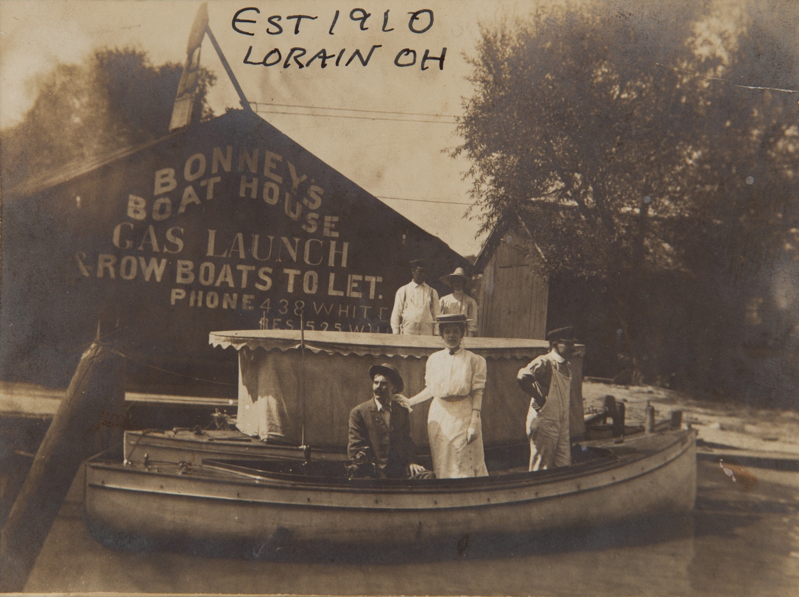 1910, "Est 1910, Lorain OH", On building: "BONNEY'S BOAT HOUSE, GAS LAUNCH, ROW BOATS TO LET, PHONE 438 White, E5525 ?"